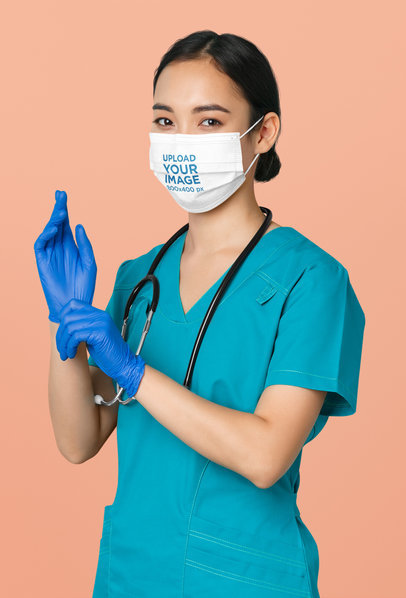 Face Mask Mockup of a Female Nurse Wearing Latex Gloves at a Studio 