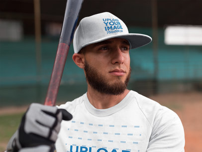 Batter Watching the Field While Wearing a Raglan T-Shirt and a Hat Mockup