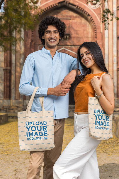 Sublimated Tote Bag Mockup Featuring a Happy Man and a Woman Posing Together