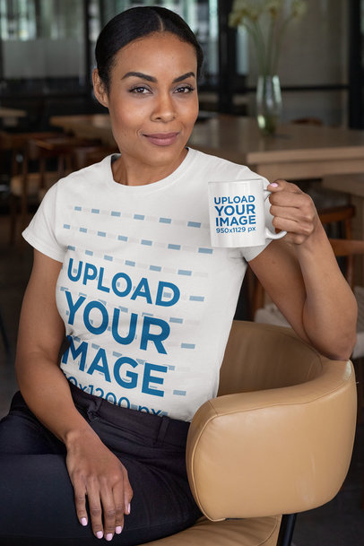T-Shirt Mockup of a Woman Sitting on a Chair Holding an 11 oz Coffee Mug