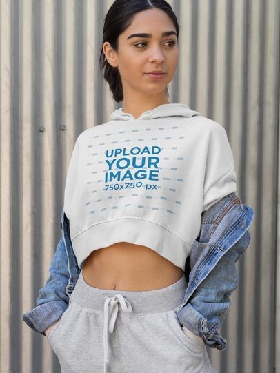 Crop Top Hoodie Mockup Featuring a Cool Woman Wearing an Athleisure Style