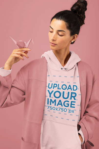 Hoodie Mockup of a Woman with an Origami Figure