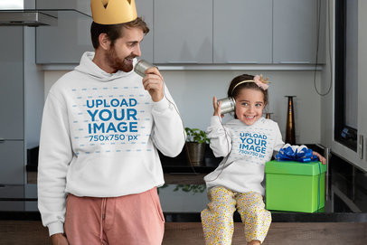 Hoodie Mockup Featuring a Man Playing With His Daughter on Father's Day 