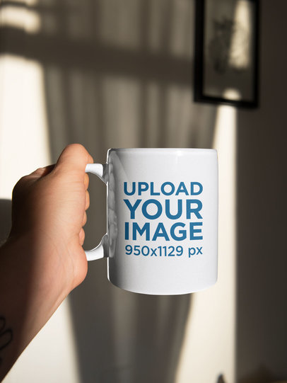 Sticker Mockup Featuring a Man Holding a Coffee Mug 