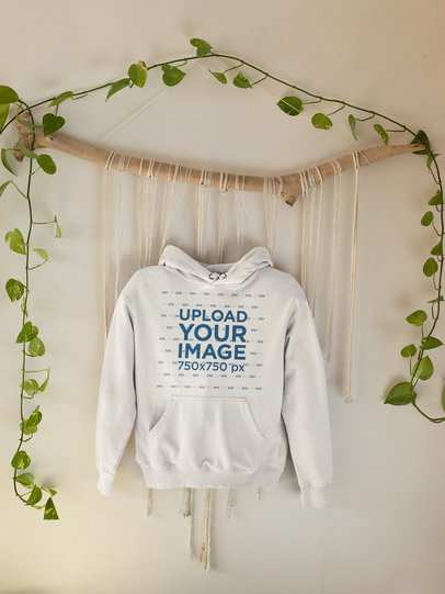 Mockup of a Pullover Hoodie Hanged by Some Leaves
