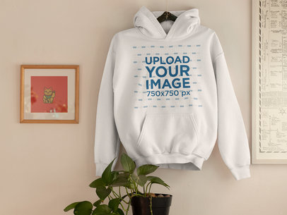 Mockup of a Hoodie as a Decorative Piece on a Wall