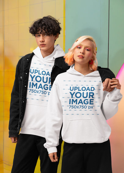 New Pop Wave-Style Mockup of a Young Couple Wearing Matching Gildan Hoodies
