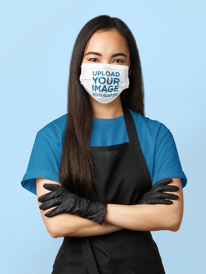 Face Mask Mockup of a Long-Haired Woman Posing With Her Arms Crossed 
