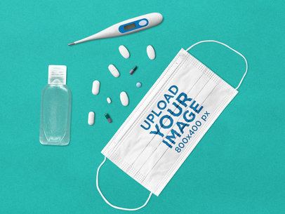 Mockup of a Face Mask with Some Medical Supplies