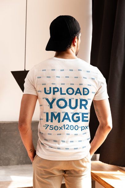 Mockup of the Back-View of a Man Wearing a Bella Canvas T-Shirt