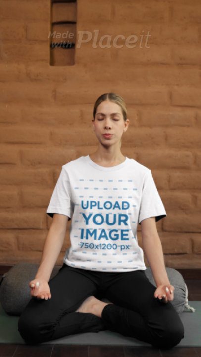 Video of a Woman Meditating in a Bella Canvas T-Shirt