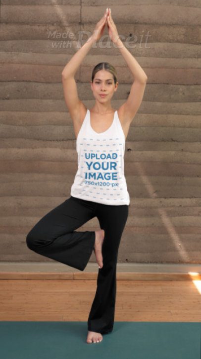 Video of a Woman in a Yoga Pose Wearing a Bella Canvas Tank Top