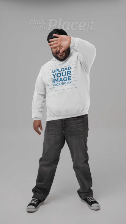 Gildan Video of a Bearded Man Wearing a Hoodie and Covering His Face