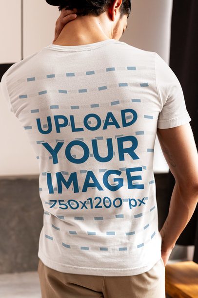 Back-View Mockup Featuring a Man Wearing a Bella Canvas T-Shirt