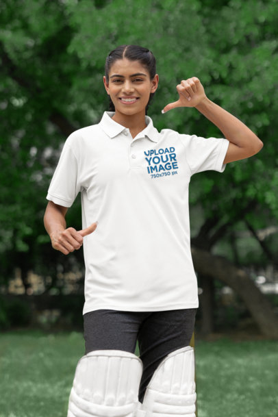 Cricket-Themed Mockup of a Happy Woman Pointing at Her Gildan Polo Shirt