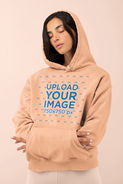 Mockup of a Woman Comfortably Wearing a Hoodie