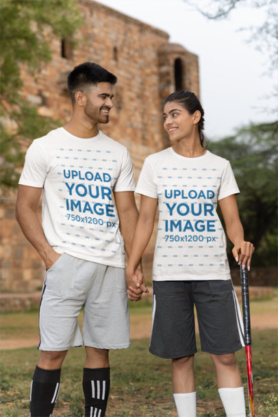 Mockup of a Smiling Couple of Cricket Players Wearing Crewneck T-Shirts