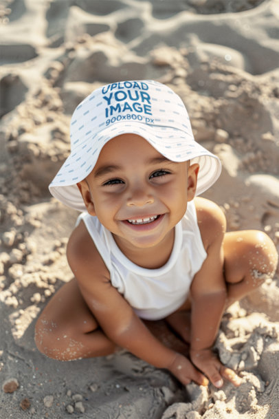 Bucket Hat Mockup Featuring an AI-Created Smiling Little Boy Sitting in the Sand
