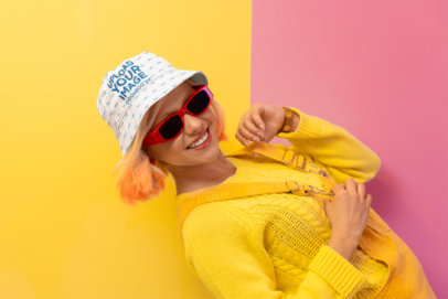 Bucket Hat Mockup Featuring a Cheerful Woman in a New Pop Wave-Themed Setting