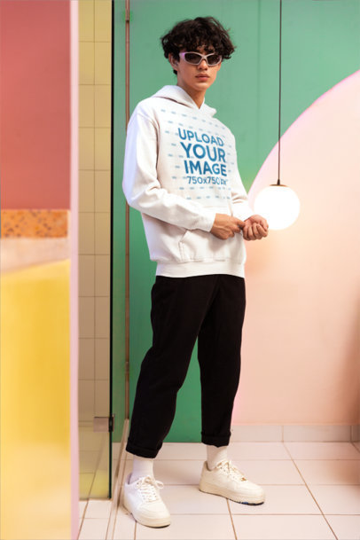 New Pop Wave-Inspired Mockup of a Man Wearing a Gildan Pullover Hoodie