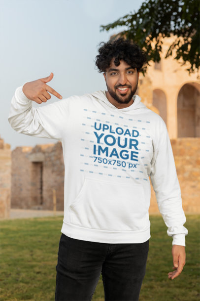 Mockup of a Man Happily Pointing at His New Plus Sized Gildan Hoodie