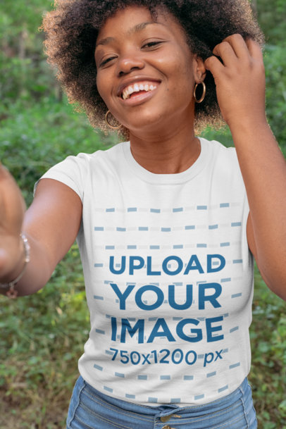 Selfie T-Shirt Mockup of a Smiling Woman in the Woods