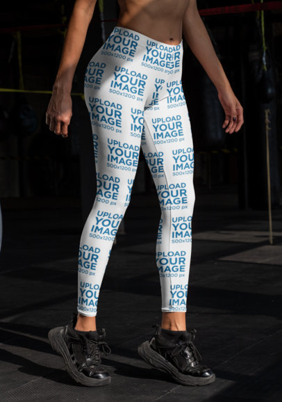 Cropped Face Mockup of a Woman Wearing Sublimated Leggings at the Gym 