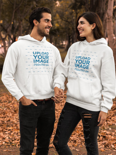 Pullover Hoodie Mockup Featuring a Couple by Brown Leaves