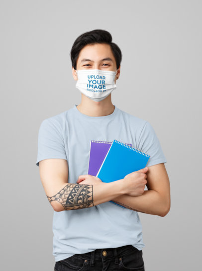 Face Mask Mockup Featuring a Tattooed Student in a Studio