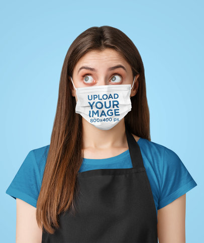 Mockup of a Young Waitress Wearing a Face Mask in a Studio