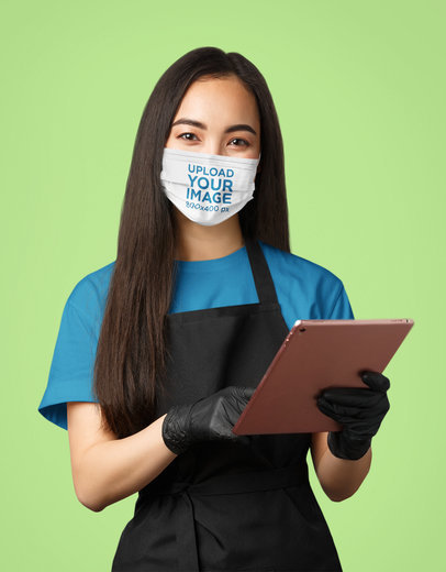 Face Mask Mockup Featuring a Waitress in a Studio