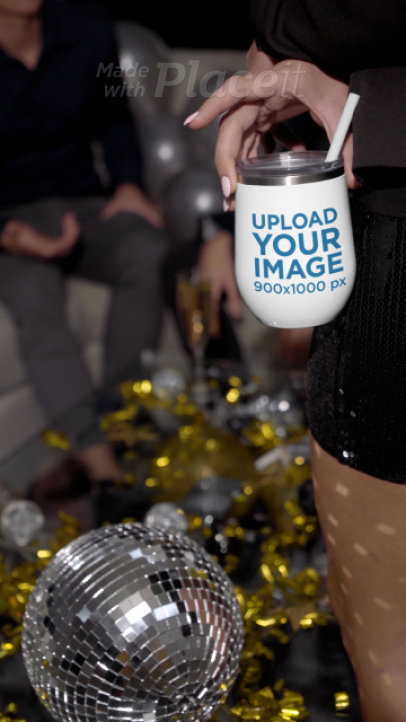 Video of a Woman Holding a Wine Tumbler at a New Year's Eve Party