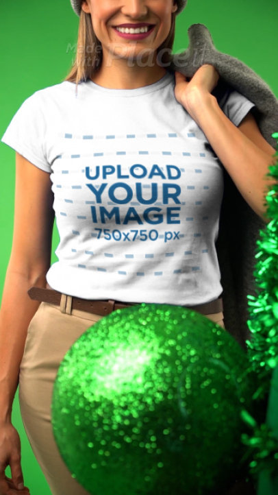 T-Shirt Video of a Happy Woman Posing in a Christmas-Decorated Setting