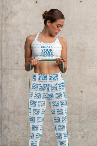 Sports Bra Mockup Featuring a Woman With High-Waisted Leggings Working Out 